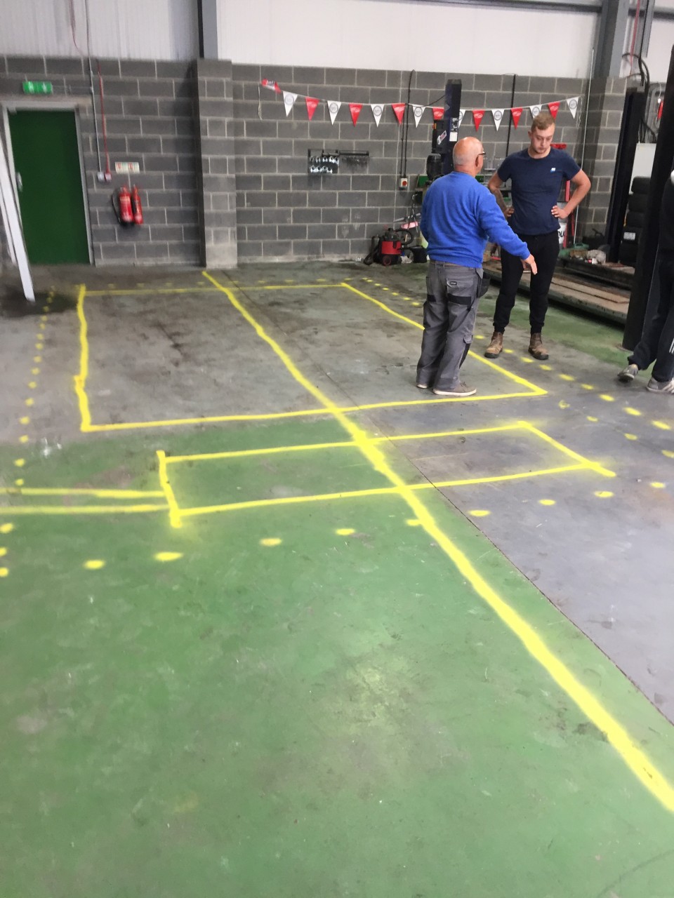 MARKING OUT THE AREA FOR EXCAVATION TO INSTALL A BRAND NEW MOT BAY AT FUSION AUTOS.