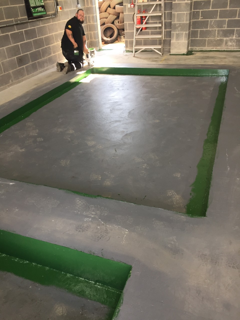 COMPLETED AND SET CONCRETE READY FOR THE INSTALLATION OF THE NEW MOT EQUIPMENT.