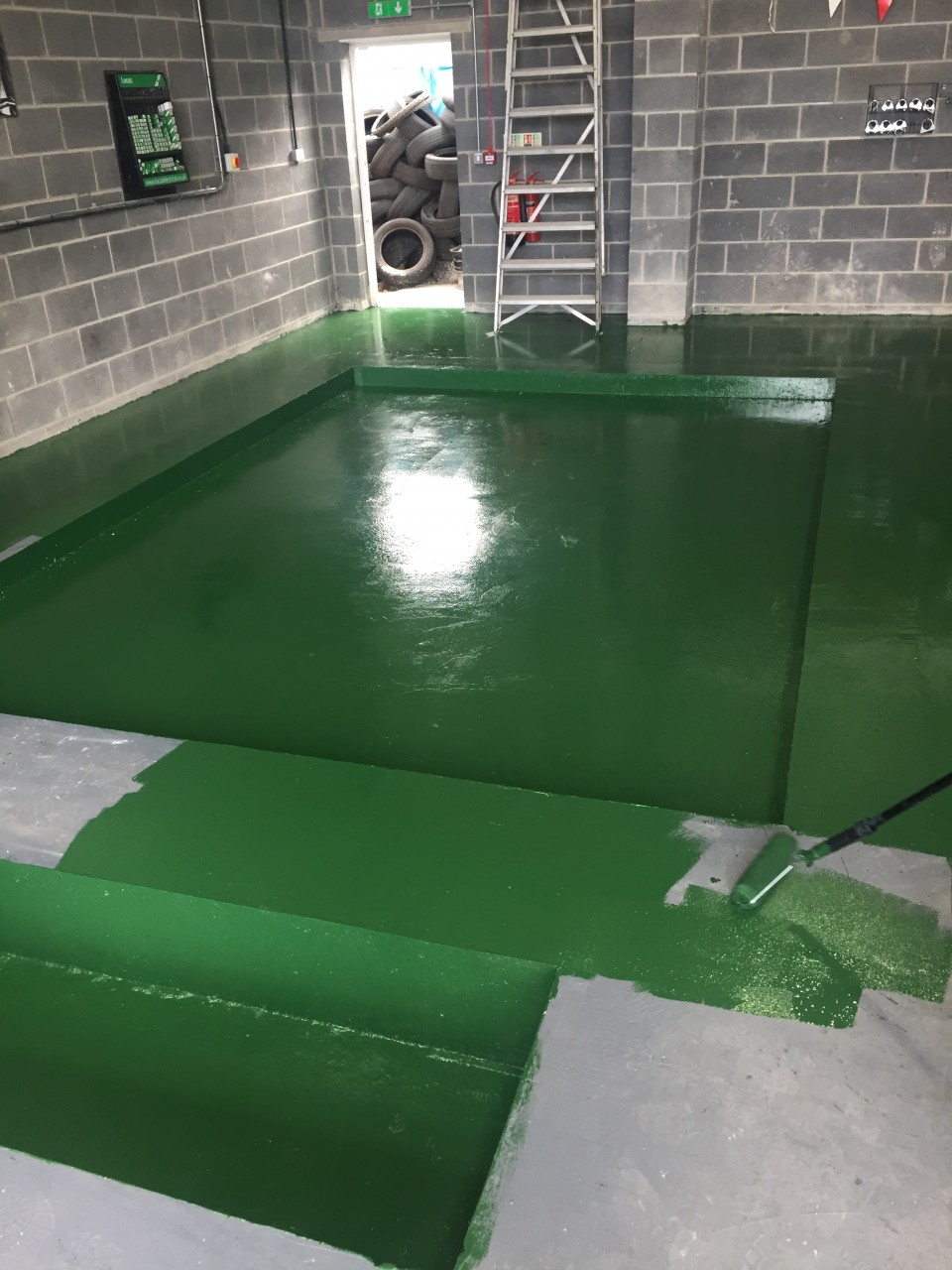 AESTHETICS ARE IMPORTANT TOO - THE FUSION AUTOS GREEN PAINT BEING PAINTED TO THE FLOOR.