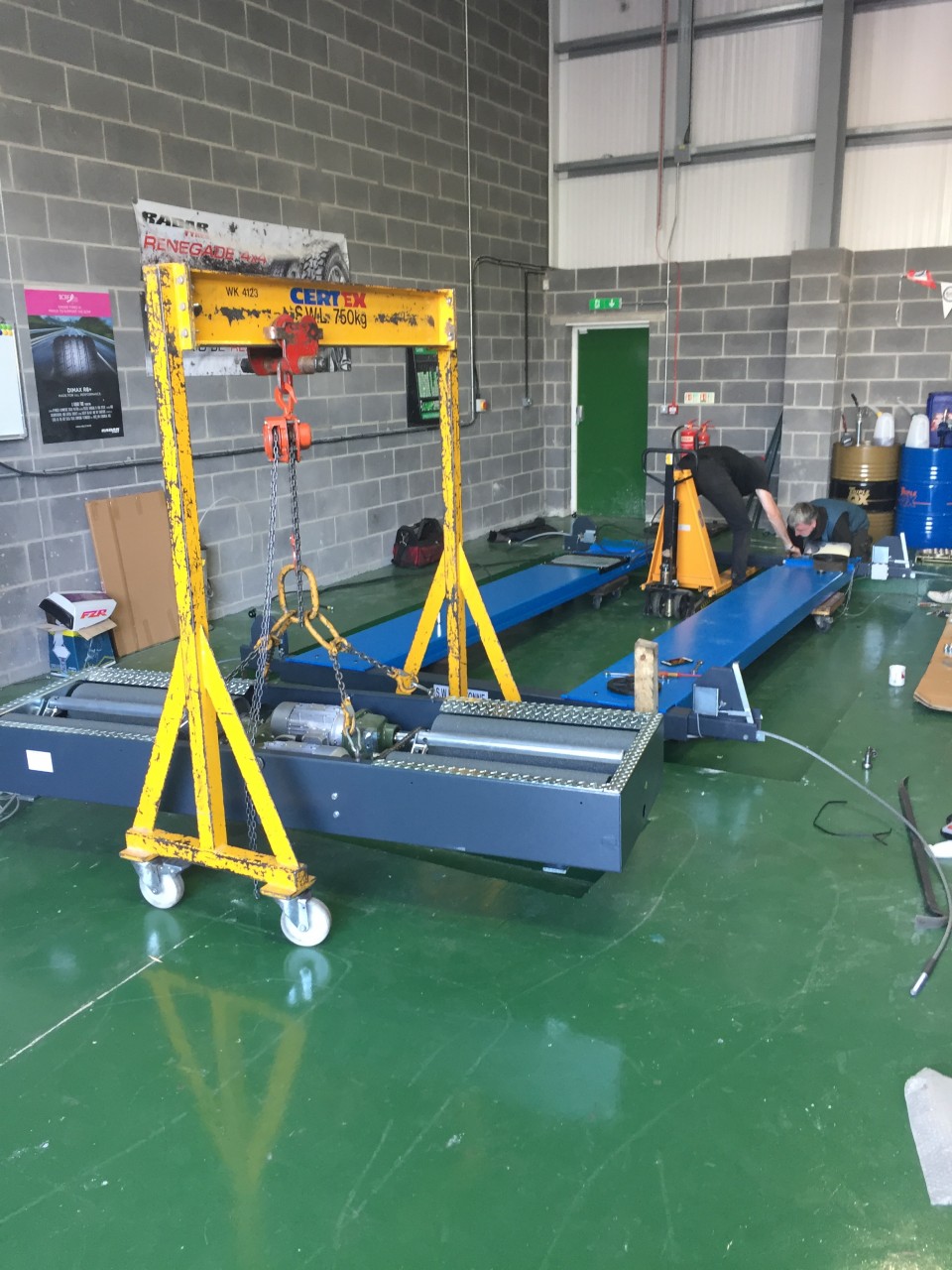 THE INSTALLED MOT RAMP AND THE BRAKE TESTERS LIFTED ON THE CRANE, READY FOR INSTALLATION.