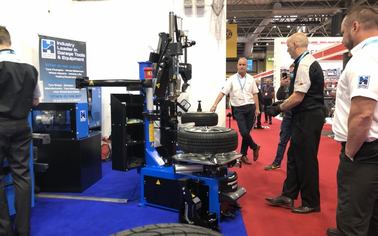 The team and delegates watch on as a Live Tyr Changer demo is completed at Automechanika 2018