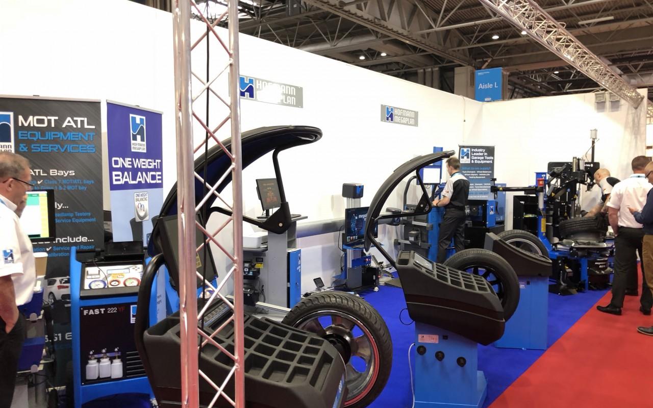 Full stand shot including wheel balancers, tyre changers and alignment equipment
